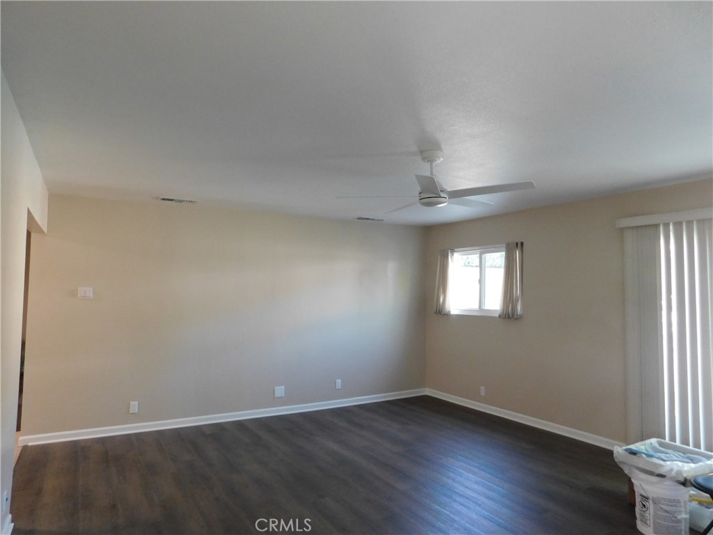 755 Valley View Avenue, Unit B Monrovia, CA 91016 - Photo 11 of 25 an empty room with wooden floor and windows