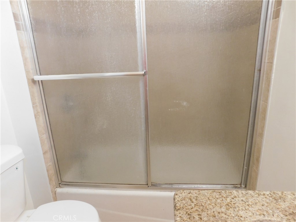 755 Valley View Avenue, Unit B Monrovia, CA 91016 - Photo 14 of 25 a bathroom with a glass shower door