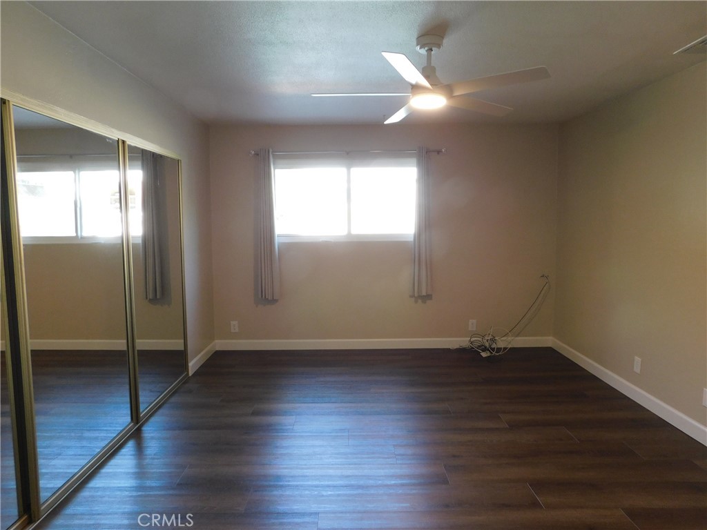 755 Valley View Avenue, Unit B Monrovia, CA 91016 - Photo 19 of 25 an empty room with wooden floor and windows
