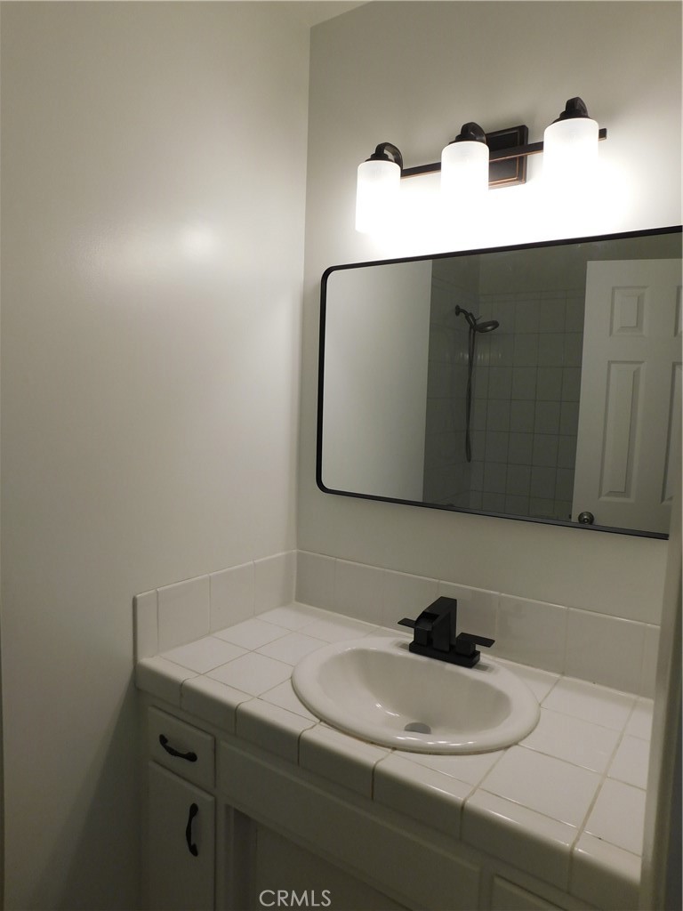 755 Valley View Avenue, Unit B Monrovia, CA 91016 - Photo 20 of 25 a bathroom with a sink and a mirror