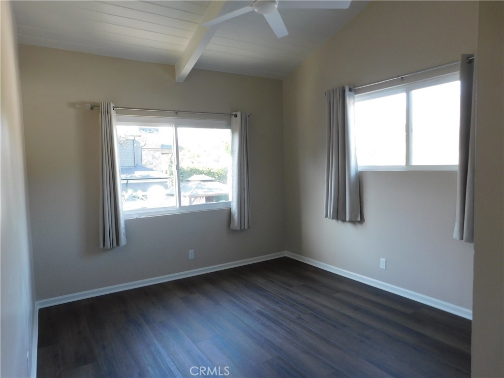 755 Valley View Avenue, Unit B Monrovia, CA 91016 - Photo 22 of 25 a view of an empty room with wooden floor and a window