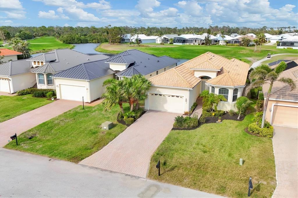 7 Windward Road Placida, FL 33946 - Photo 2 of 34 an aerial view of a house with a yard and lake view