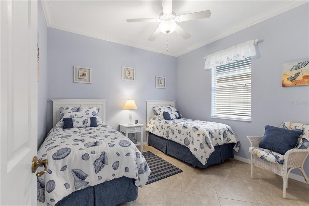 7 Windward Road Placida, FL 33946 - Photo 21 of 34 a bedroom with two beds and painting on the wall