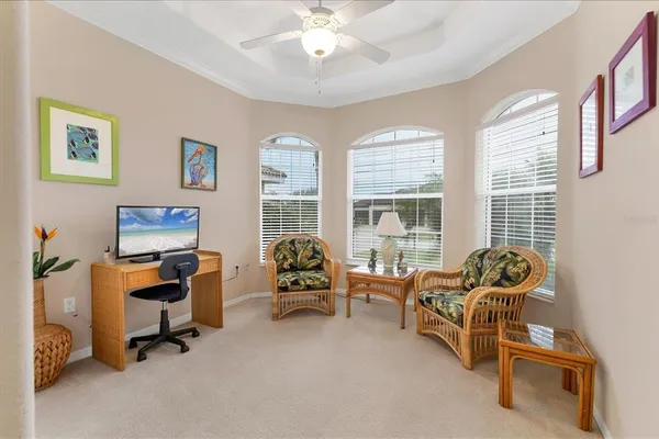 a work room with furniture and windows