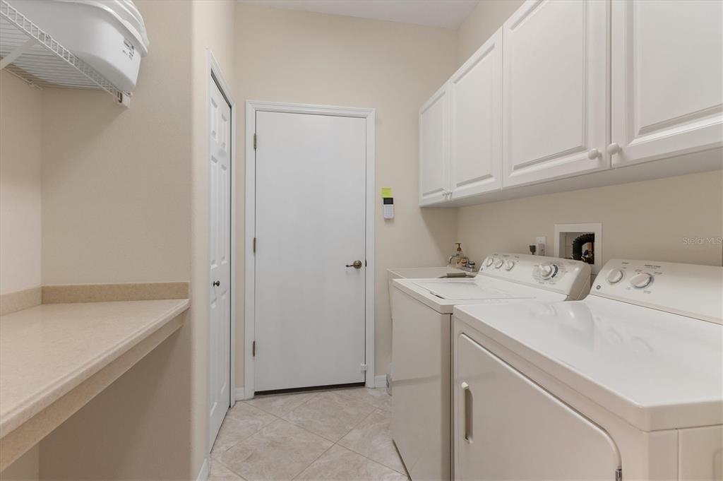 7 Windward Road Placida, FL 33946 - Photo 25 of 34 a utility room with cabinets washer and dryer