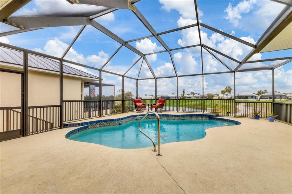7 Windward Road Placida, FL 33946 - Photo 28 of 34 a swimming pool with outdoor seating