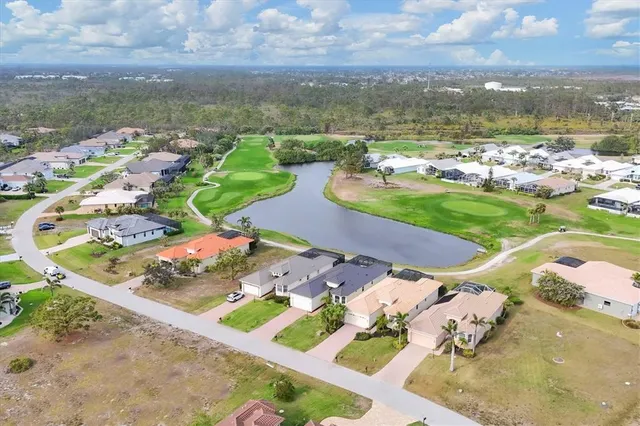 an aerial view of a house with a ocean view