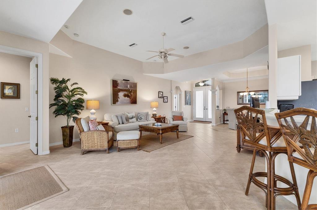 7 Windward Road Placida, FL 33946 - Photo 9 of 34 a living room with furniture and a potted plant
