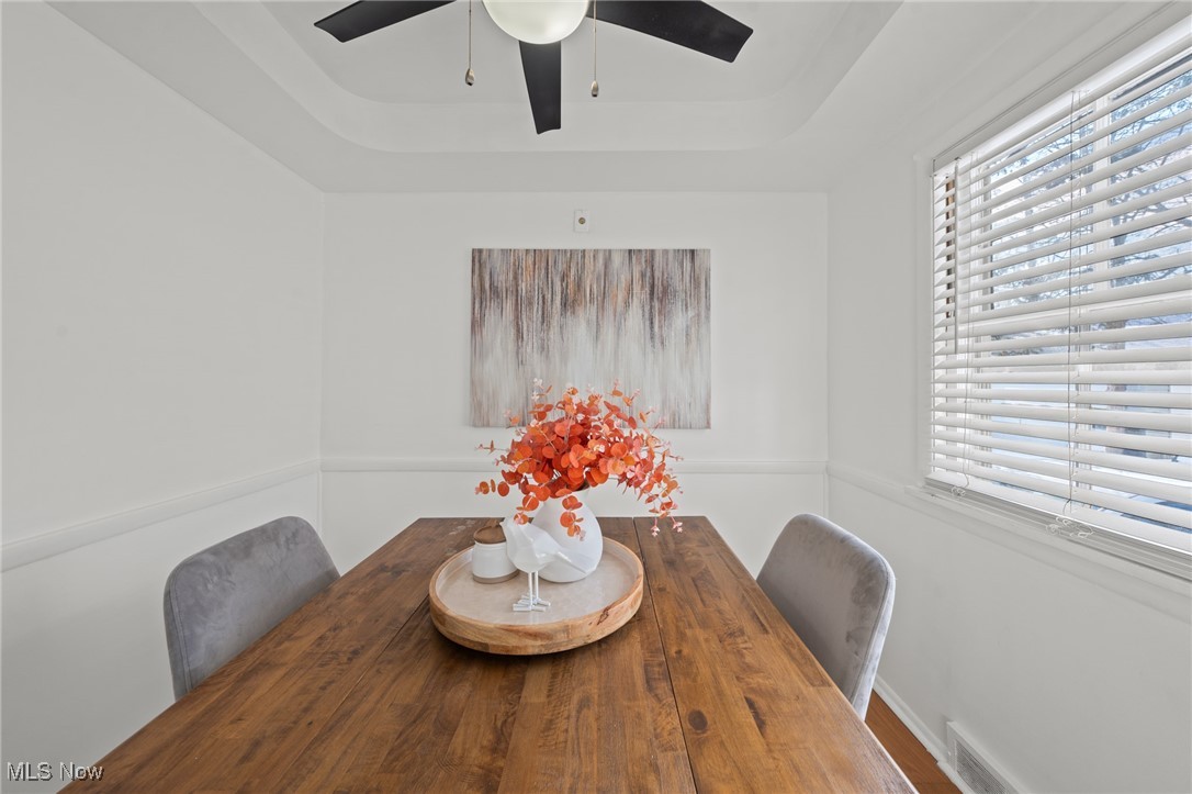 3686 Riedham Road Cleveland, OH 44120 - Photo 18 of 50 Dining room with hardwood / wood-style flooring, a raised ceiling, and ceiling fan