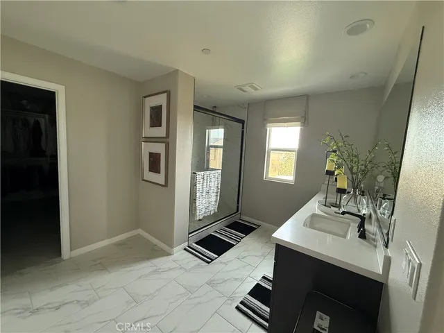a living room with a sink and a mirror