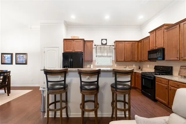 a living room with fireplace furniture and a flat screen tv
