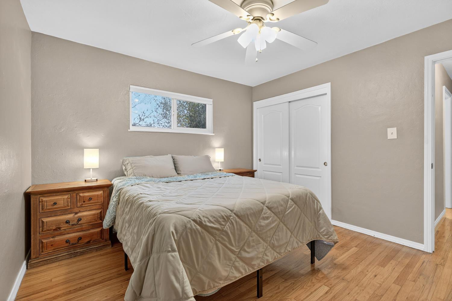 1507 West Locust Street Lodi, CA 95242 - Photo 17 of 28 a bedroom with a bed and a chandelier