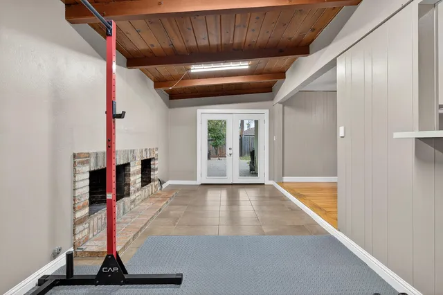 a view of an empty room with a fireplace