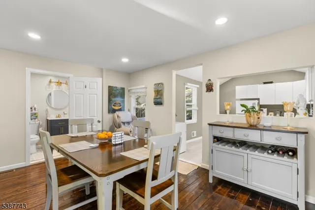 a large kitchen with a table and chairs