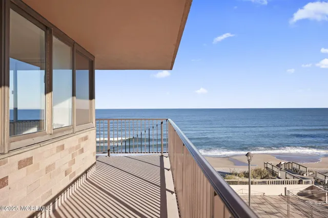 a view of balcony with wooden floor