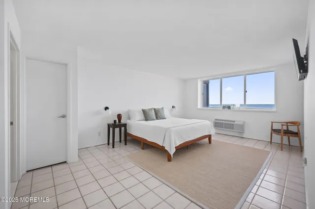 a bedroom with a bed and a table in it