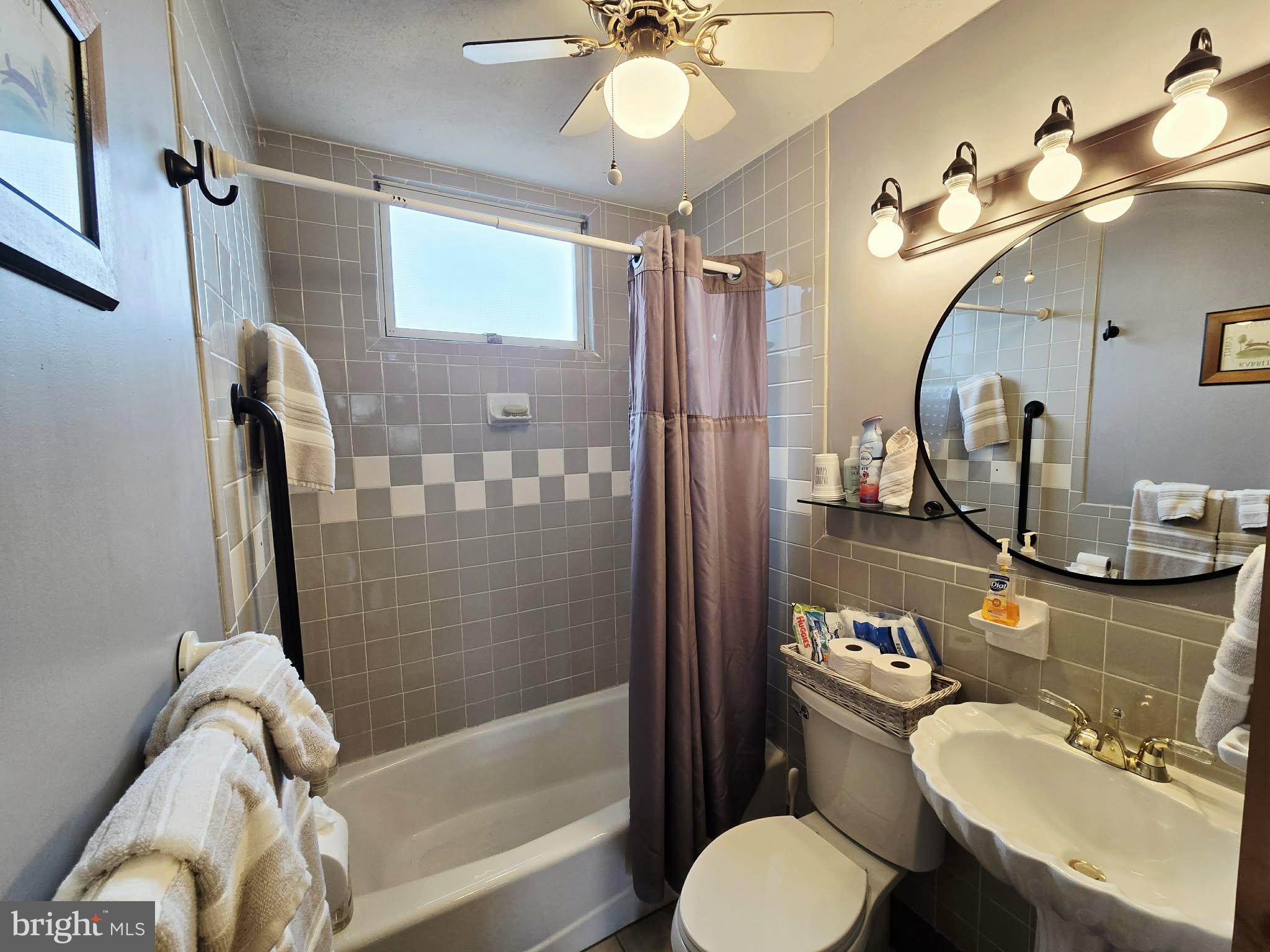 1120 Sandy Ridge Road Sugar Grove, WV 26815 - Photo 16 of 53 a bathroom with a sink mirror vanity and toilet