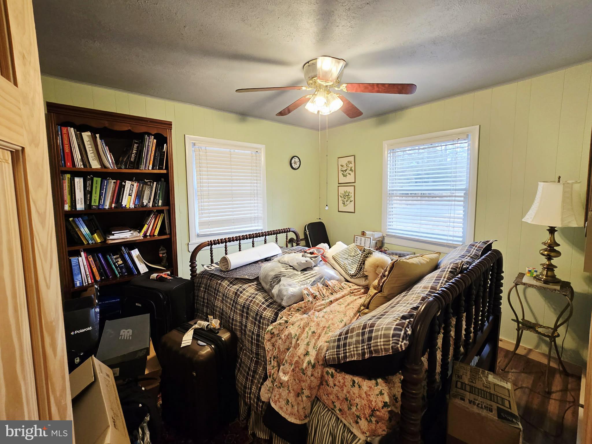 1120 Sandy Ridge Road Sugar Grove, WV 26815 - Photo 18 of 53 a view of a livingroom with furniture and a bookshelf