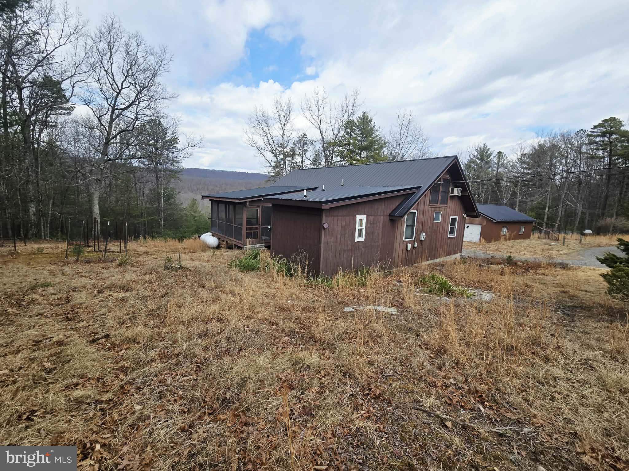 1120 Sandy Ridge Road Sugar Grove, WV 26815 - Photo 29 of 53 a backyard of a house with lots of green space