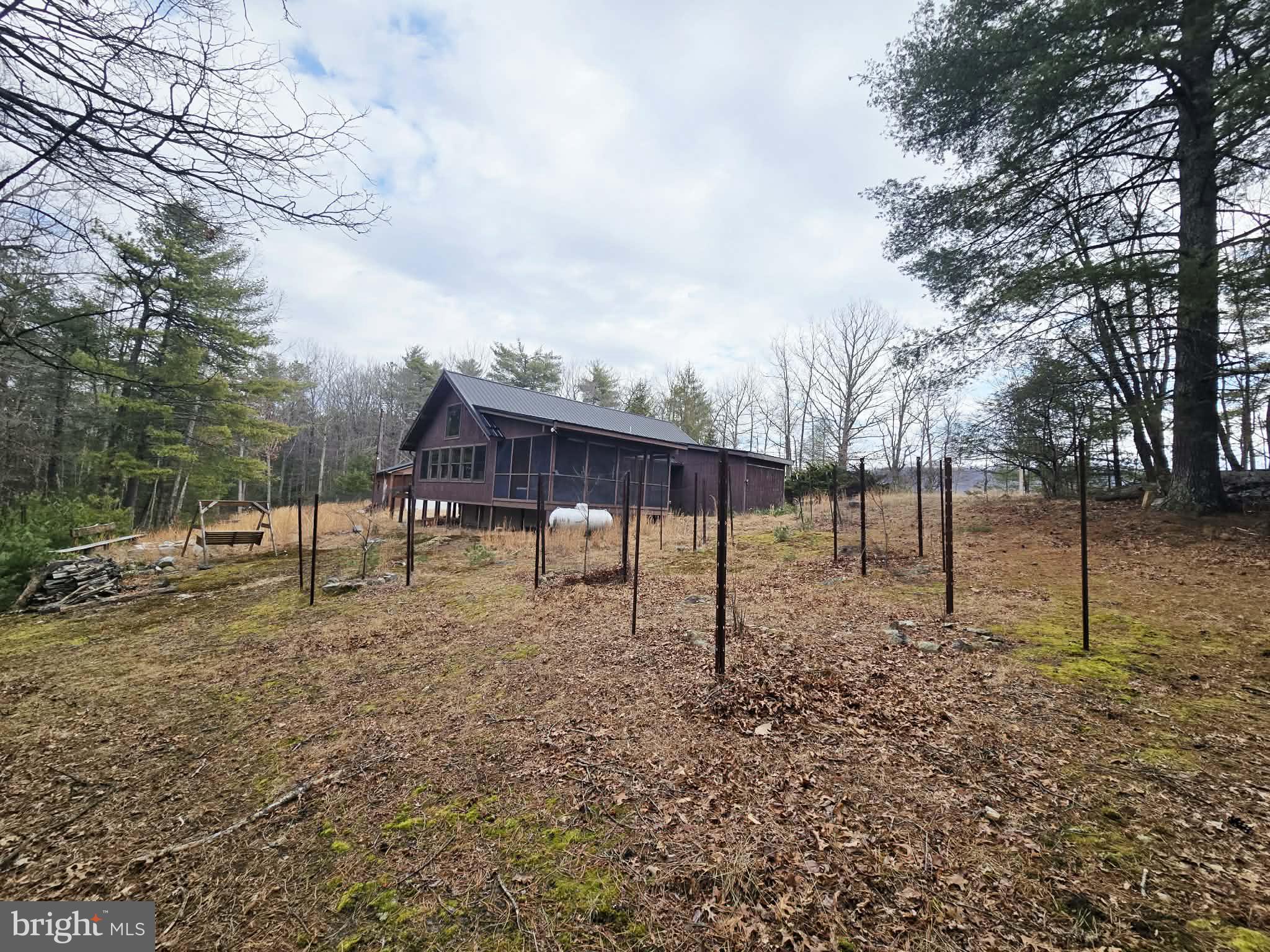 1120 Sandy Ridge Road Sugar Grove, WV 26815 - Photo 32 of 53 a backyard of a house with lots of green space