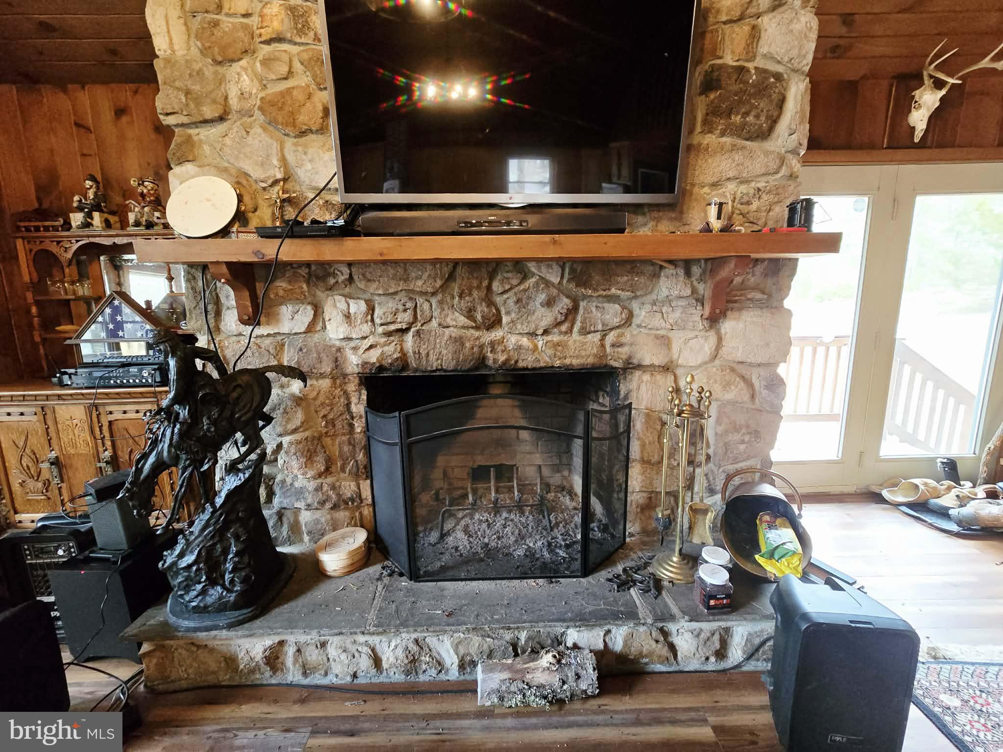 1120 Sandy Ridge Road Sugar Grove, WV 26815 - Photo 5 of 53 a living room with furniture and a fireplace