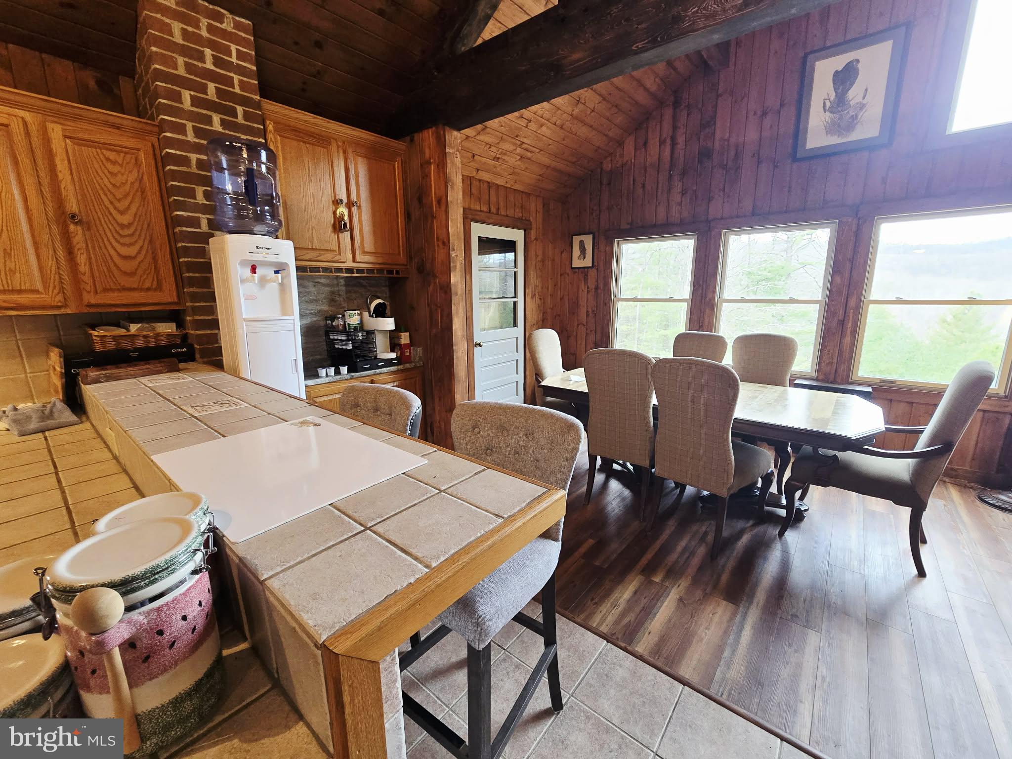 1120 Sandy Ridge Road Sugar Grove, WV 26815 - Photo 7 of 53 a table and chairs sitting in front of a house