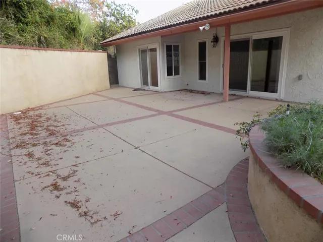 a view of house with backyard
