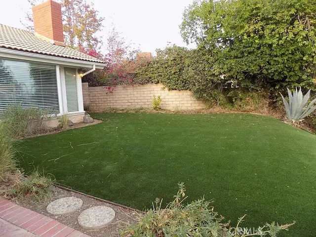 a backyard of a house with lots of green space