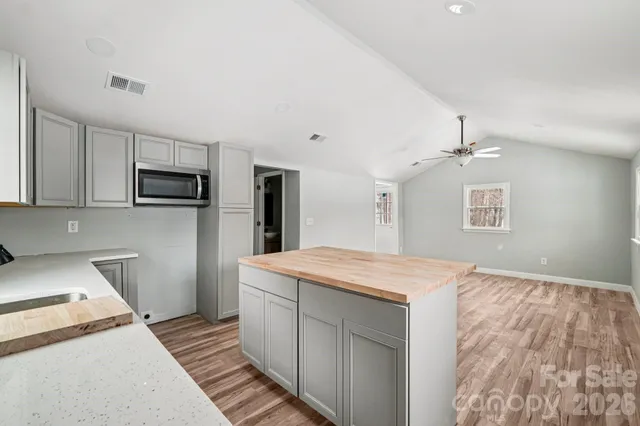 a kitchen with a sink stove and refrigerator