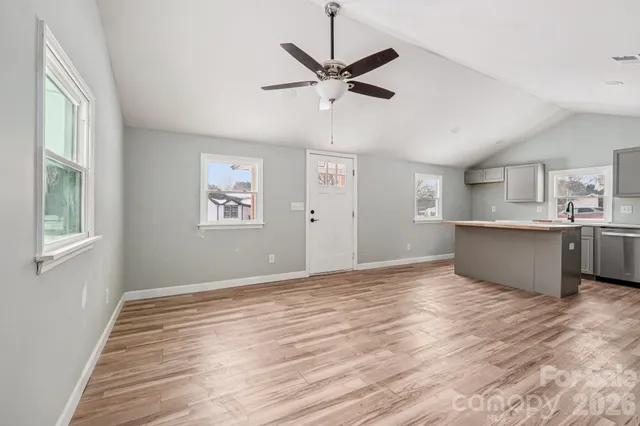 a view of a kitchen with a sink and cabinet