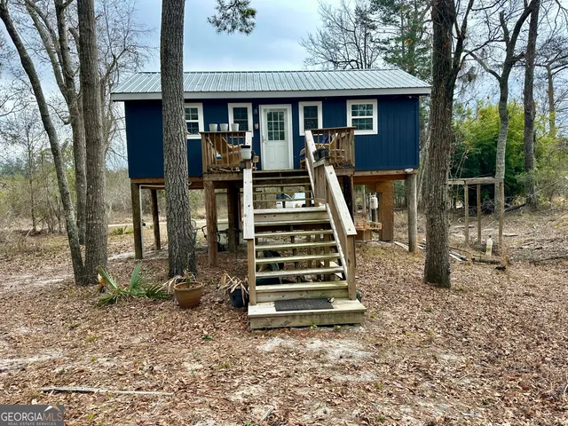 a front view of a house with deck