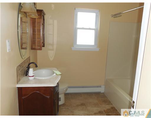 50 Fox Road, Unit 6A Edison, NJ 08817 - Photo 8 of 10 a bathroom with a sink and a mirror