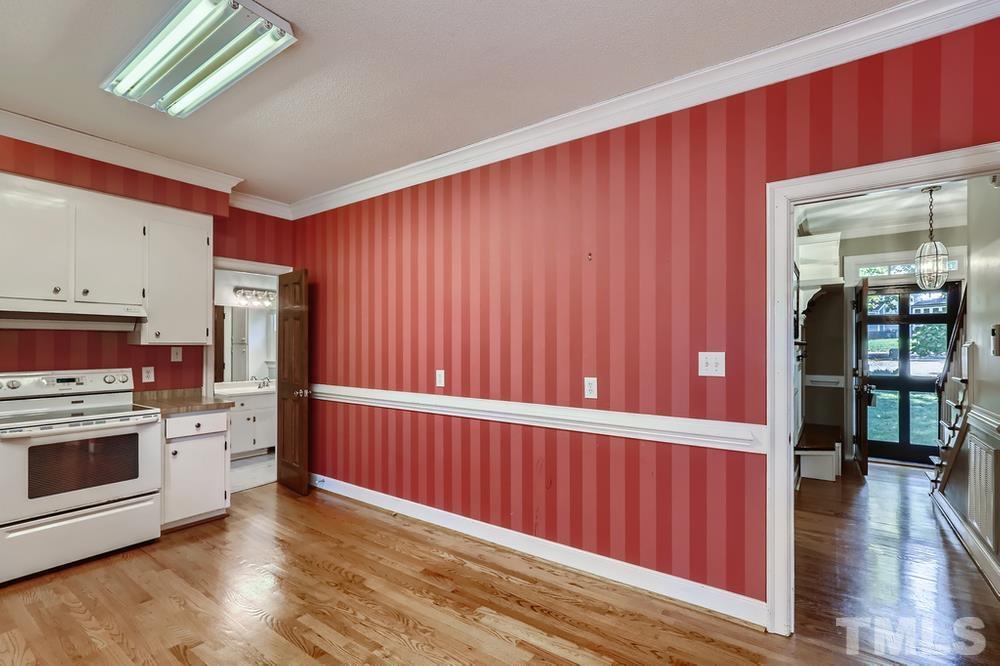 7301 Sandy Grove Court Raleigh, NC 27615 - Photo 11 of 28 a view of a kitchen with furniture and wooden floor