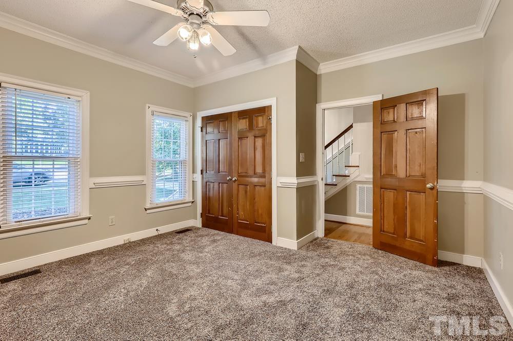 7301 Sandy Grove Court Raleigh, NC 27615 - Photo 13 of 28 an empty room with windows and entryway