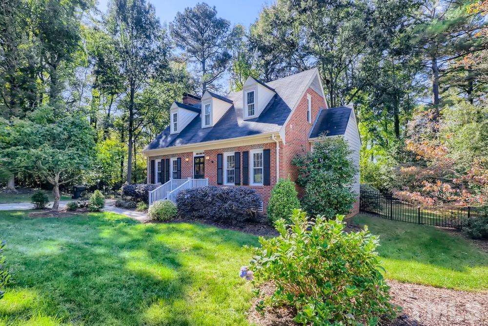 7301 Sandy Grove Court Raleigh, NC 27615 - Photo 3 of 28 a front view of house with yard and green space