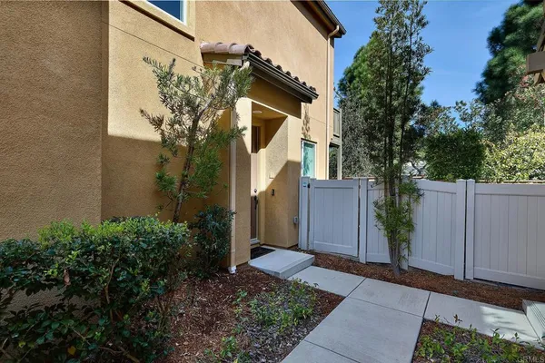 a view of a house with a small yard