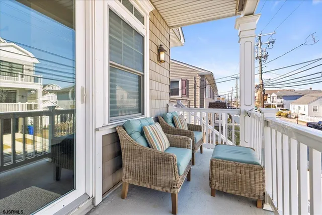 a balcony with furniture and city view