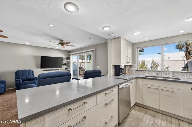 a living room with furniture and flat screen tv