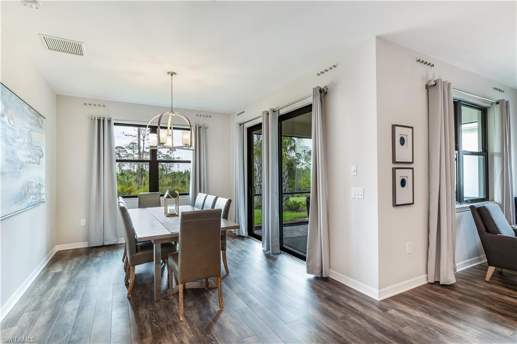 16216 Palmetto Street Babcock Ranch, FL 33982 - Photo 11 of 16 a view of a dining room with furniture window and wooden floor