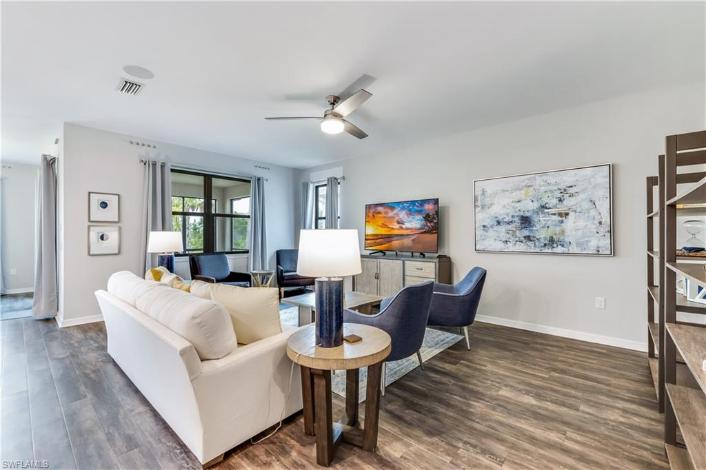 16216 Palmetto Street Babcock Ranch, FL 33982 - Photo 2 of 16 a living room with furniture and a wooden floor