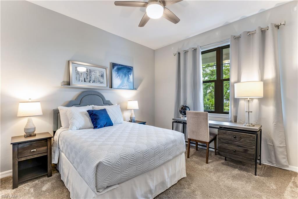 16216 Palmetto Street Babcock Ranch, FL 33982 - Photo 4 of 16 a bedroom with a bed and a chandelier