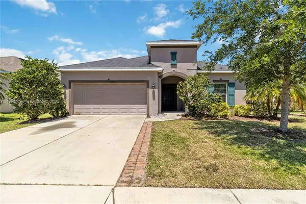 front view of a house with a yard