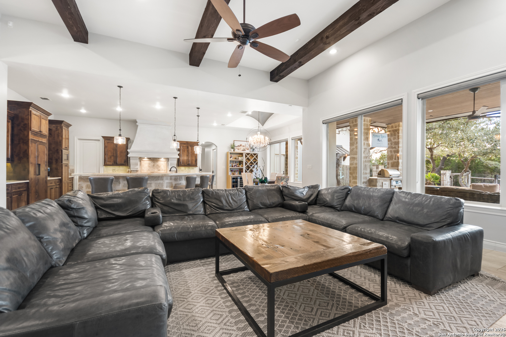 9 Ranch Brook Road Boerne, TX 78015 - Photo 15 of 59 a living room with furniture and a large window