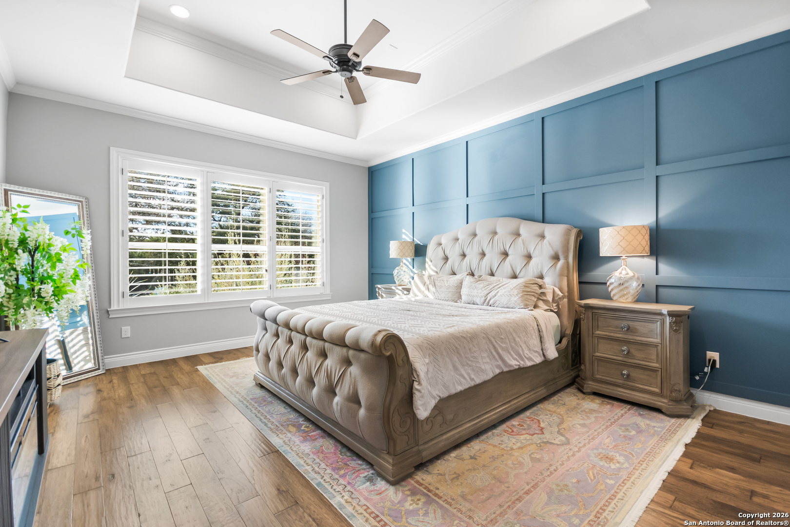 9 Ranch Brook Road Boerne, TX 78015 - Photo 21 of 59 a bedroom with a large bed and a chandelier