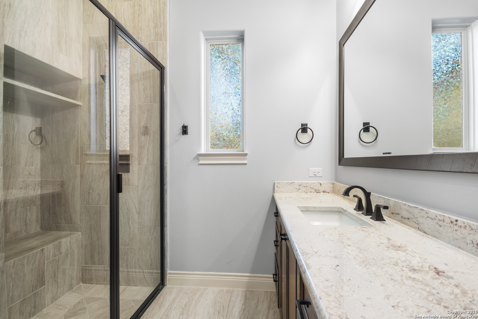 9 Ranch Brook Road Boerne, TX 78015 - Photo 26 of 59 a bathroom with a sink and a mirror