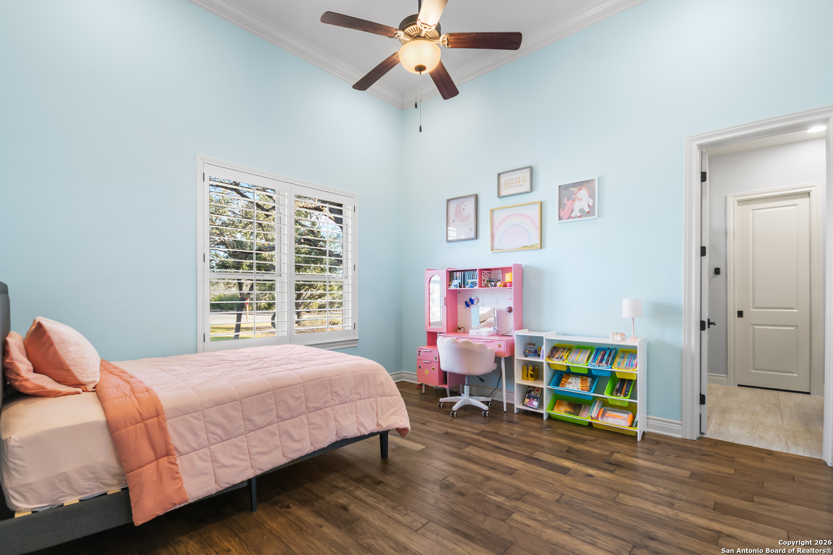 9 Ranch Brook Road Boerne, TX 78015 - Photo 27 of 59 a bedroom with a bed and a chandelier