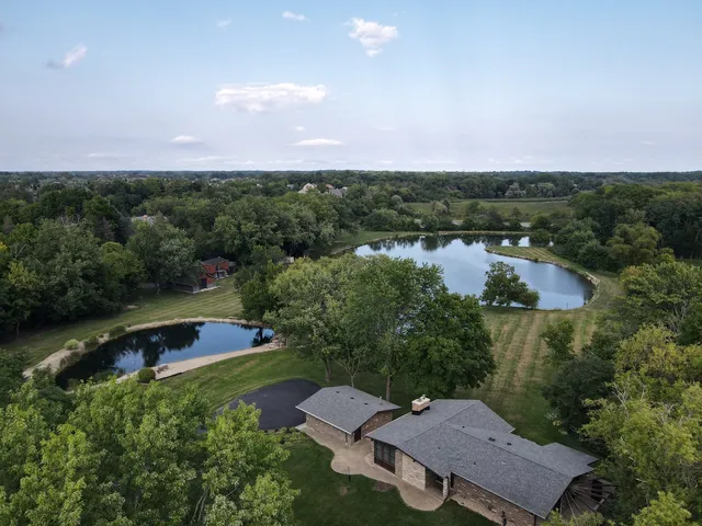 an aerial view of a house with mountain view