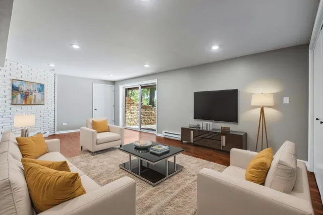 an aerial view of a house with garden space and lake view