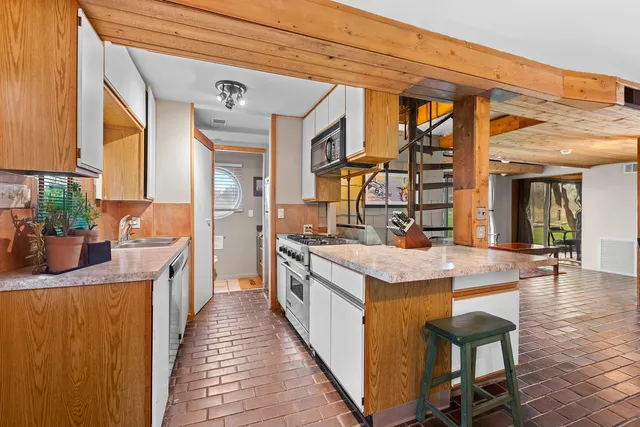 a outdoor space with lots of furniture and large windows