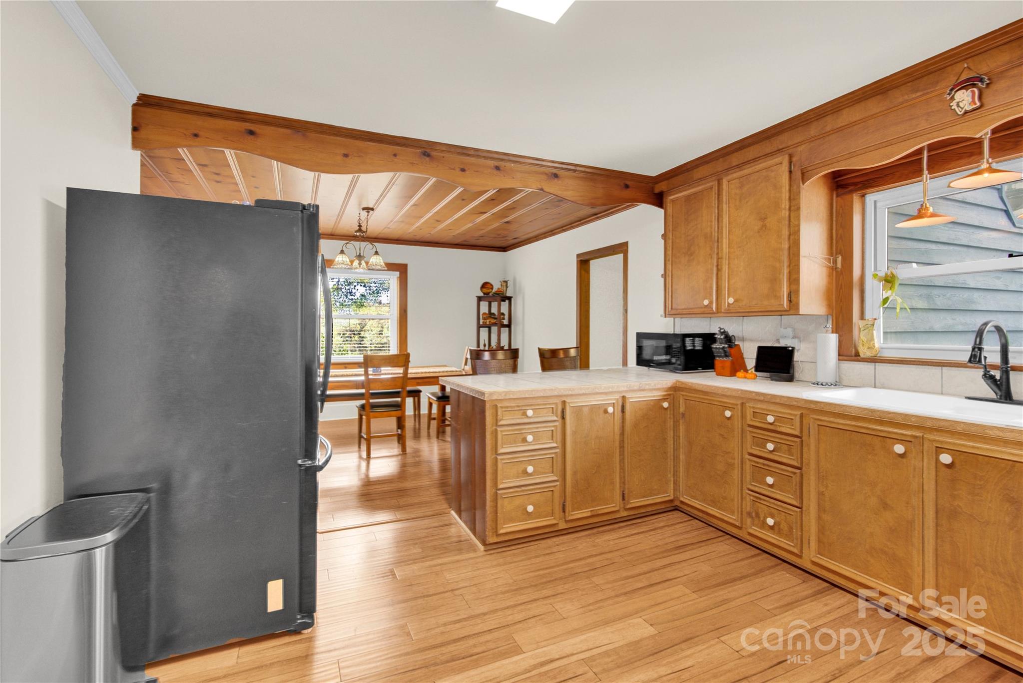 11720 Kluttz Road Gold Hill, NC 28071 - Photo 11 of 35 a kitchen with sink cabinets and wooden floor